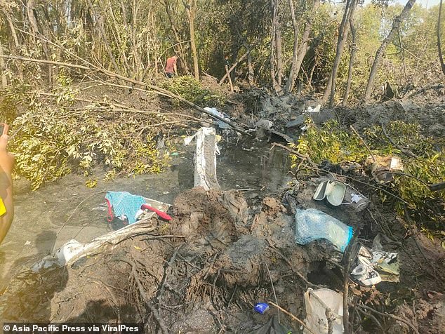 Clothes and belongings are seen scattered on the ground after the plane crash.