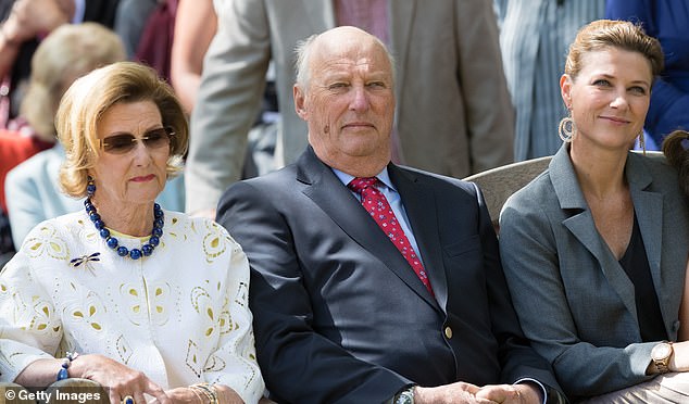 Queen Sonja of Norway and King Harald of Norway are pictured with their daughter Princess Martha Louise in 2017