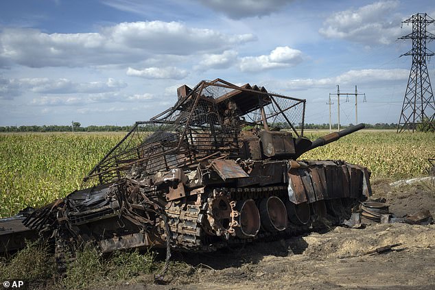 A destroyed Russian tank lies on the side of a road near the town of Sudzha, Russia, in the Kursk region, August 16, 2024.