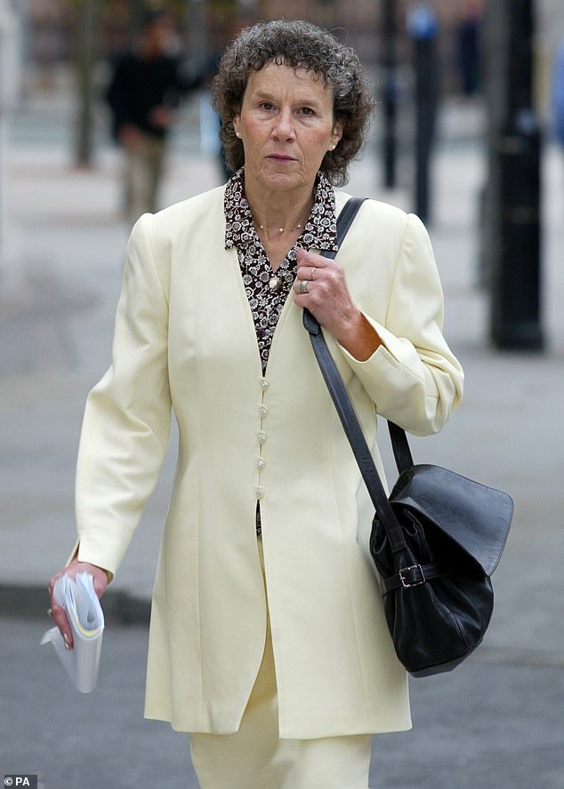 Angela Woodruff is pictured on her way to trial. Her husband, Phill, blames his mother for the shock caused by her mother's Alzheimer's death.