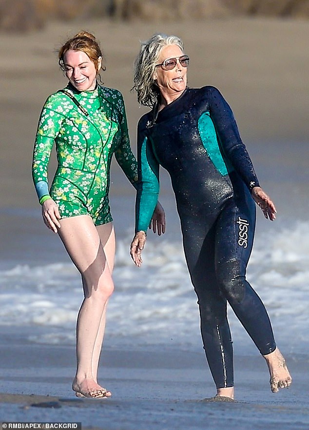 Curtis, 65, modeled a full-body wetsuit in navy and teal as she read her lines and held on to the New York native.