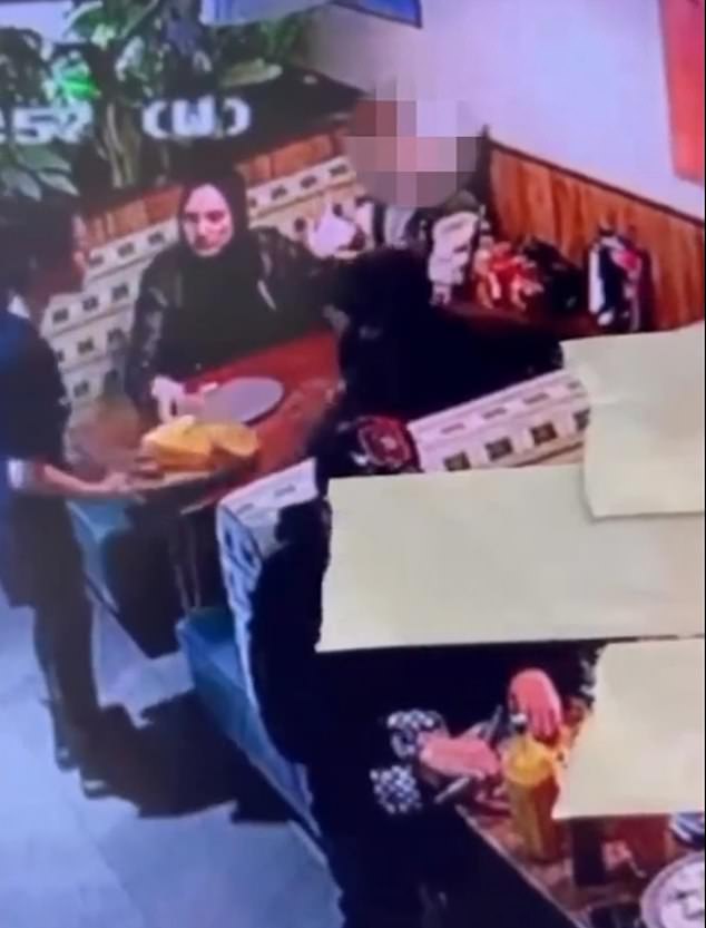 The video shows the waitress placing a plate of food on the table seconds before the man attacked her.