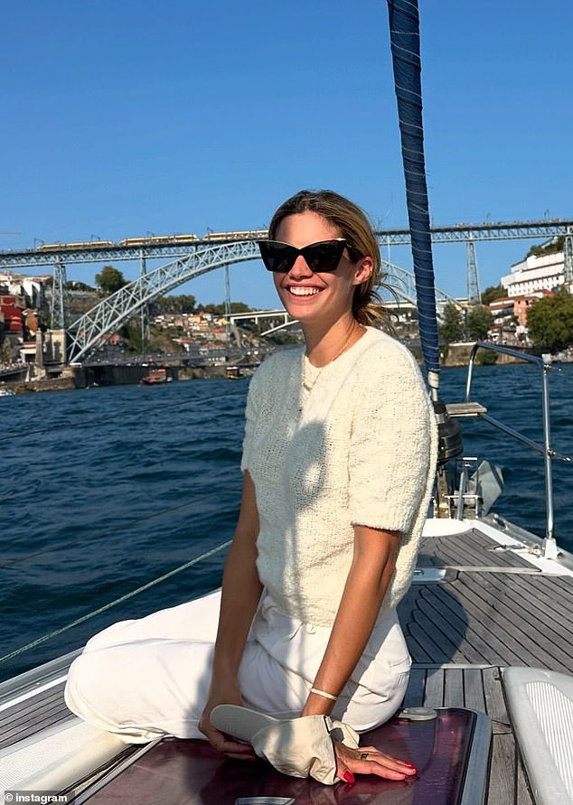 Sara smiled brightly during a picturesque boat ride in Porto, Portugal