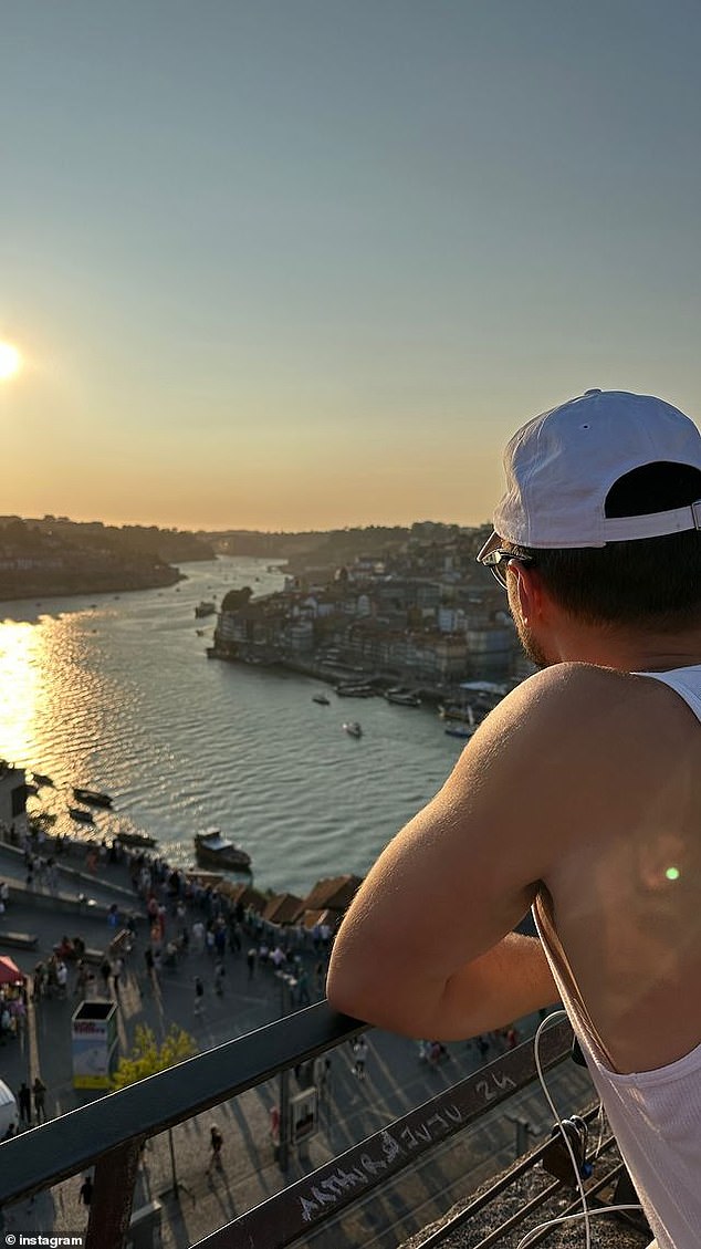 She captured a photo of Ray looking out at the views from a balcony.