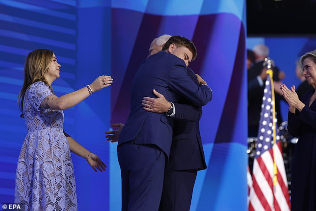 Tim Walz hugs his son, Gus Walz, during the third night of the Democratic National Convention