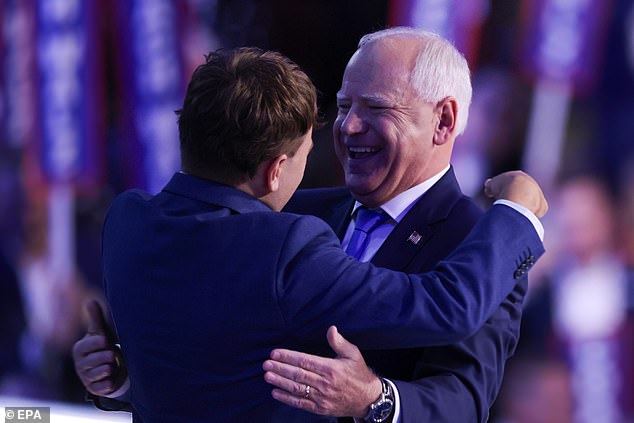 Tim Walz and his son Gus hug after his acceptance speech