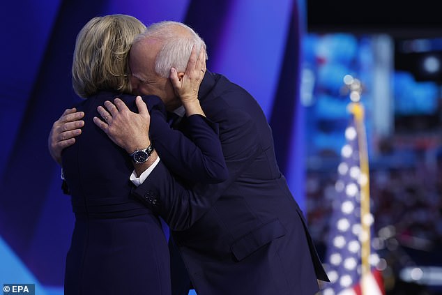 Tim Walz and his wife Gwen embrace on stage at the Democratic National Convention