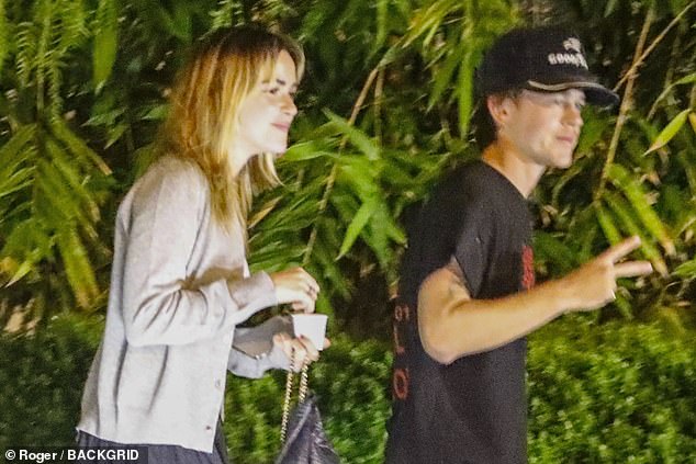 The duo was photographed hanging out in the valet parking lot outside the San Vicente Bungalows.