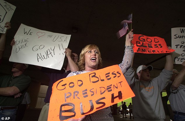 Angry: Her comments infuriated her largely conservative fan base, leading to a boycott of her music that devastated album sales and sank her chart position. Above are protesters at a May 2003 concert in Knoxville, Tennessee.