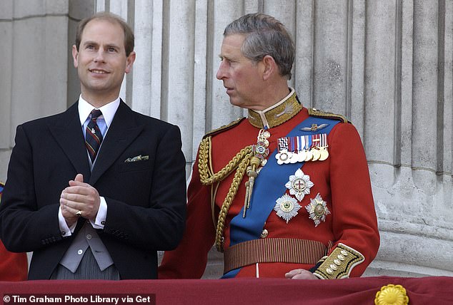 Prince Edward speaking to Charles on the balcony of Buckingham Palace in 2003