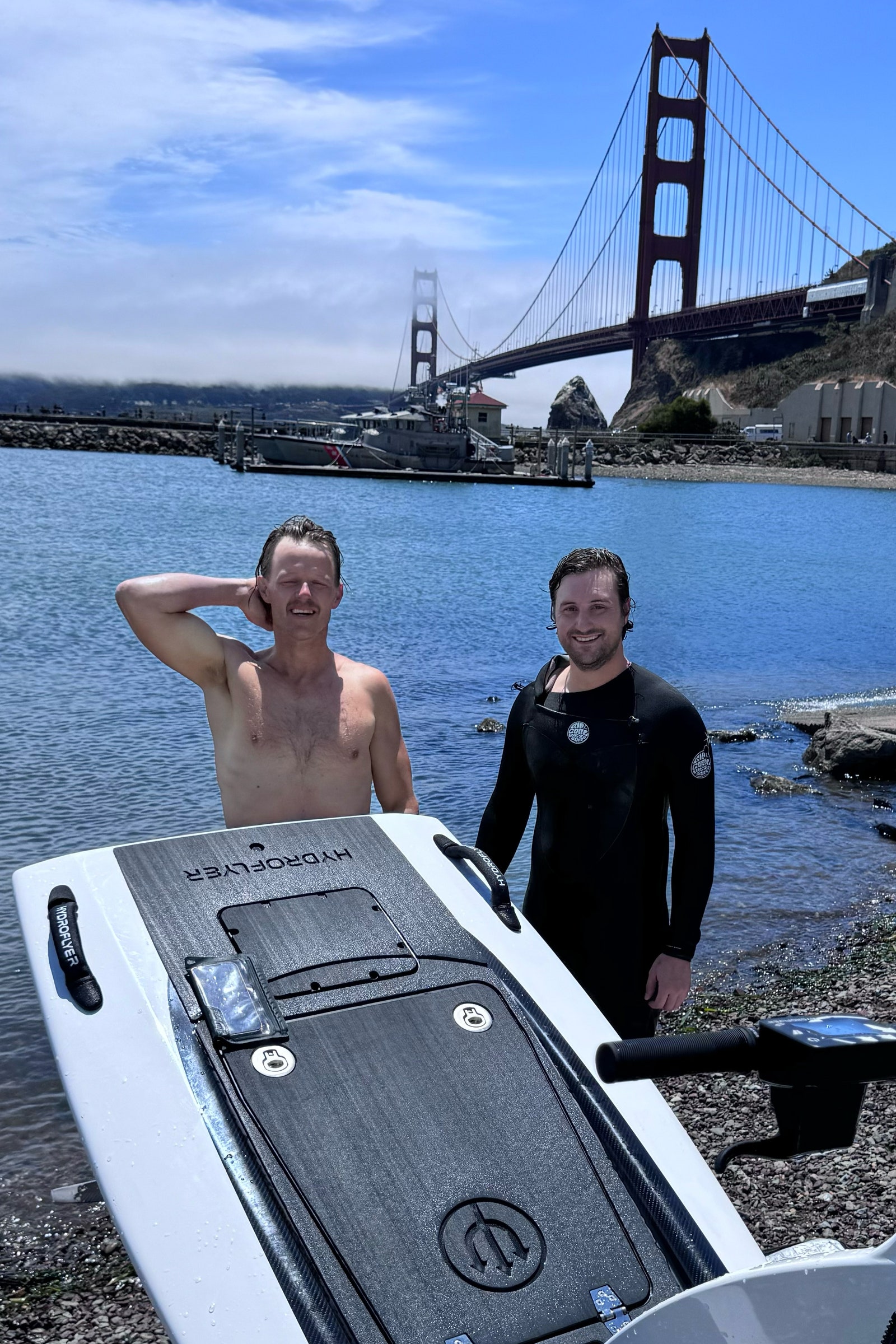 A photo of Jerry and Boone testing the hydrofoil under the Golden Gate Bridge in San Francisco.