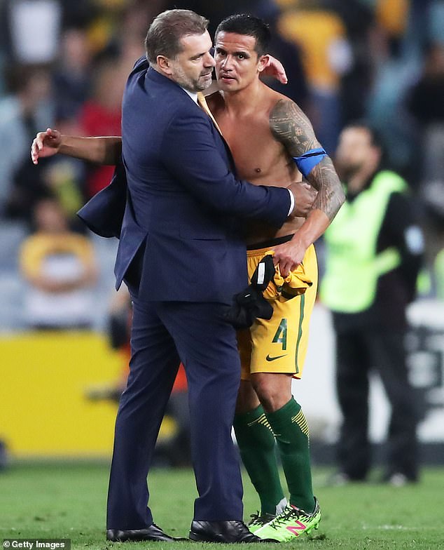 Ange Postecoglou also coached Australia at the 2014 World Cup and ensured the Socceroos qualified for the 2018 World Cup in Russia (pictured, with Tim Cahill)