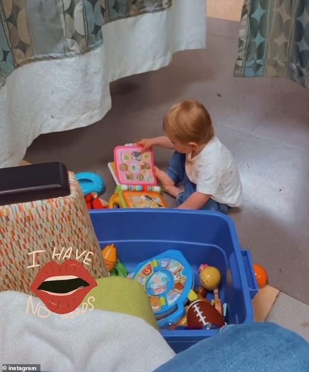 She turned the camera to show her toddler playing with toys. She smiled a little as she listened to her two-year-old son Sidney trying to sing and babble.