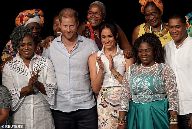 Prince Harry joined his wife Meghan on stage after she spoke at an event focused on empowering Afro-Colombian women.