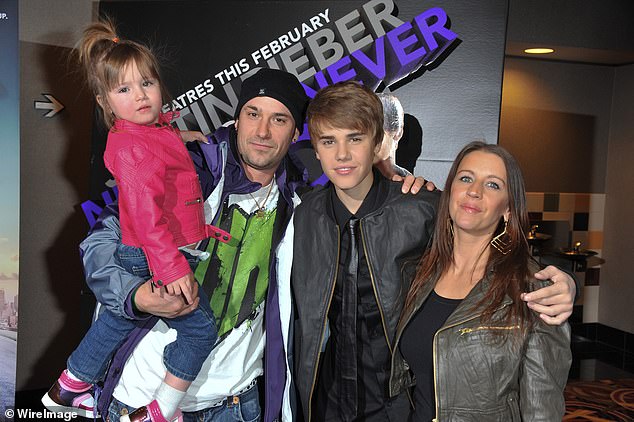 Despite not seeing her father often while growing up, the pair later reconnected and now have a positive relationship (pictured in 2011 with her mother Pattie and half-sister Jazmyn).