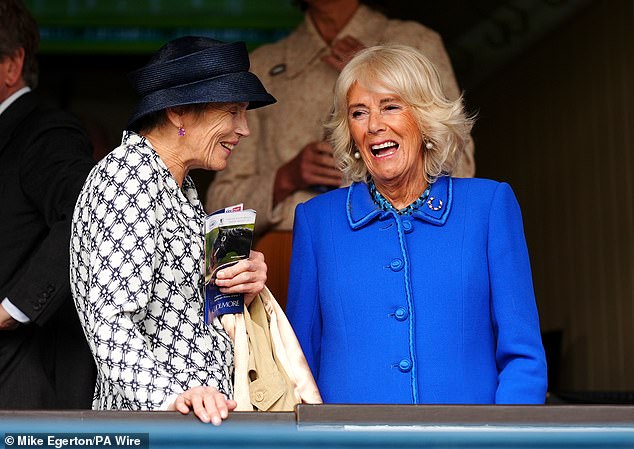 Camilla's brooch also has letters that spell out her name. 