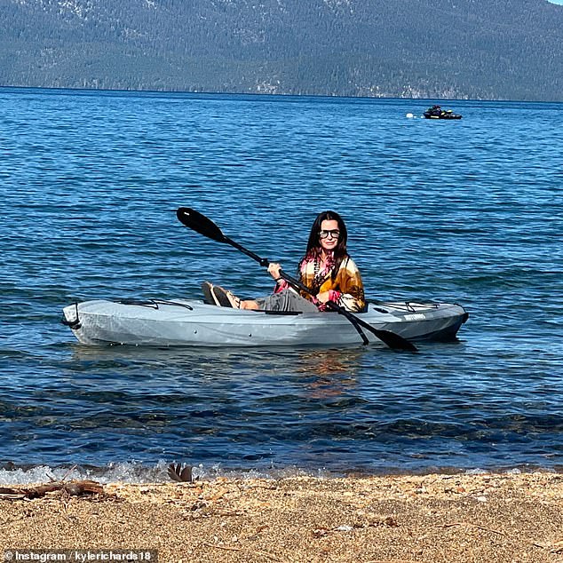 As well as sharing two photos of herself lying on a boat dock, the mother of four uploaded snaps of herself kayaking, playing pool and paddle boarding.