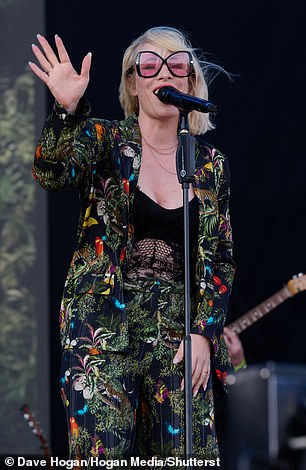 The 42-year-old singer wore an extravagant multi-coloured outfit for the event which was adorned with a butterfly print.