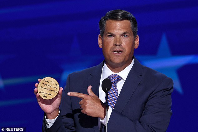 Former Republican Georgia Lt. Gov. Geoff Duncan holds a note from his son at the Democratic National Convention that reads: 