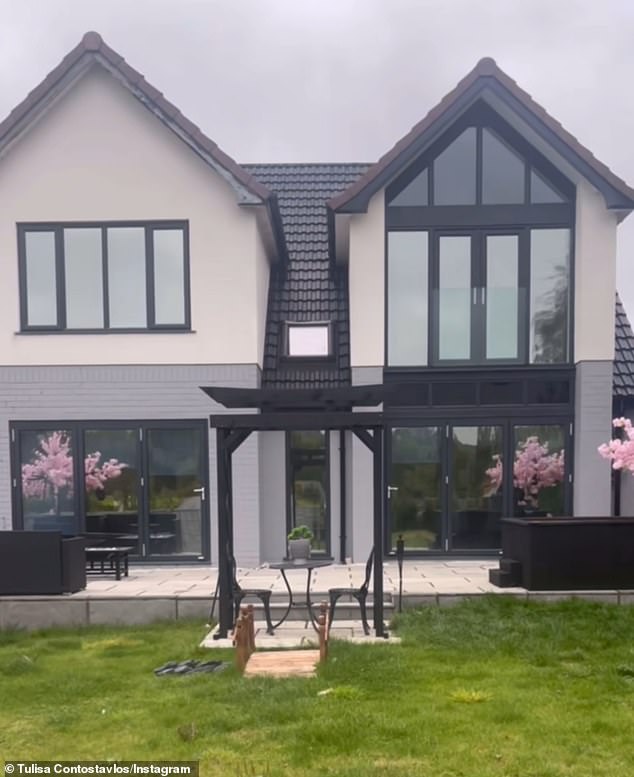 Tulisa uploaded a video of her old red brick home, before showing off the updated grey slate roof and white exterior.