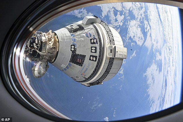 Pictured: Boeing's Starliner spacecraft, which encountered serious problems during its launch into orbit, is seen docked outside the space station on July 3, 2024.