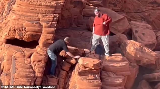 The men were allegedly caught on camera as they worked hard to push the ancient rock formation off the edge of a cliff.