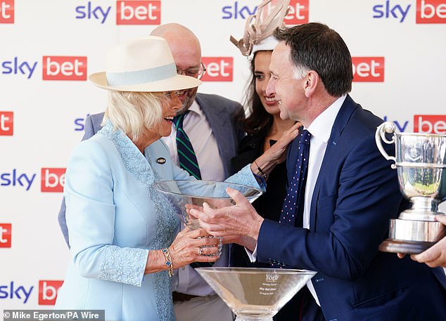 Queen Camilla (left) pictured with winning trainer Henry de Bromhead (right) on Saturday