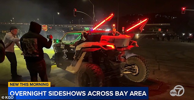 The young men took photos of the monstrous vehicle while blocking intersections.