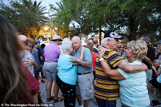 Pictured: A group of seniors dancing during a concert in The Villages.