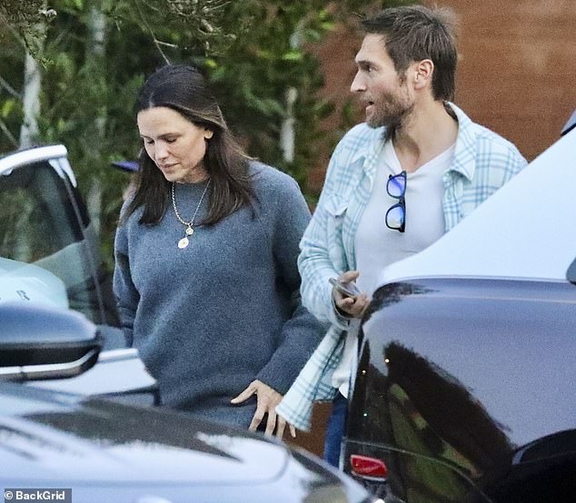 The 52-year-old actress donned an oversized grey sweater in the unusually chilly temperatures of Malibu.