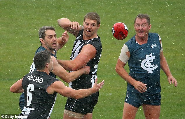 David's other star AFL son Cameron (pictured centre at a 2014 match) was felled by an off-ball hit during a game in Melbourne in 2023.