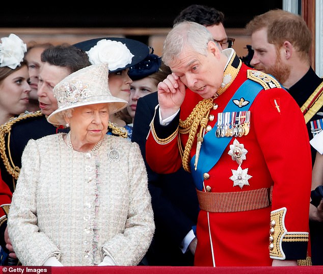 The late Queen Elizabeth II and Prince Andrew watch a flypast from the balcony of Buckingham Palace during Trooping The Colour, the Queen's annual birthday parade, on June 8, 2019