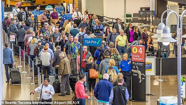 Hundreds of travelers were stranded at Seattle-Tacoma International Airport on Saturday afternoon due to flight delays and cancellations caused by a possible cyberattack.