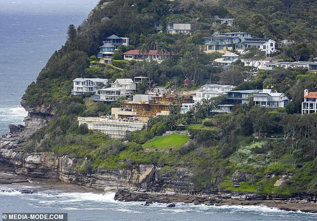 Model Jennifer Hawkins and husband Jake Walls' controversial mega-mansion on Whale Beach (above) sits on the southern tip of a huge clifftop plot of land.