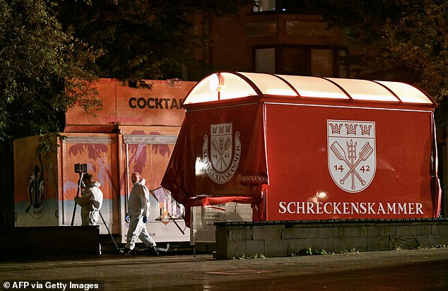 Forensic police inspect the scene where at least three people were killed and several others injured when a man attacked them with a knife on the evening of August 23, 2024 in Solingen on August 24, 2024.