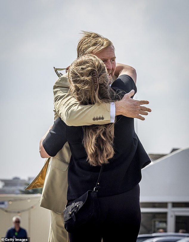 King Willem-Alexander was photographed hugging Princess Anne of the Netherlands during today's outing.