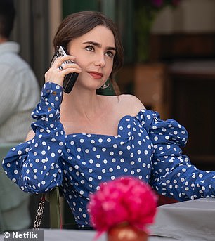 Polka dots are a big part of the fashion in part two. A snap of Emily enjoying a drink at an outdoor cafe reveals a blue and white off-the-shoulder top with a sweetheart neckline.