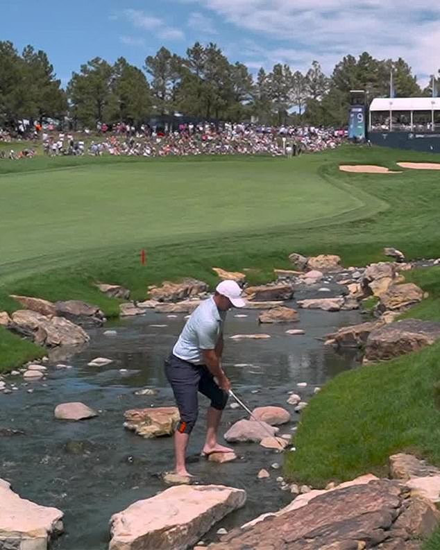 McIlroy had to remove his shoes and socks to play his second shot from the water at the ninth.