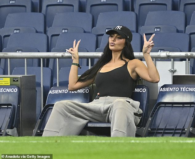 He pouted in front of a camera and held up two peace signs as he passed the time in the empty stadium.