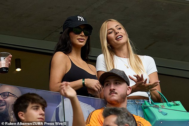 Kim watched the football match from a suite.