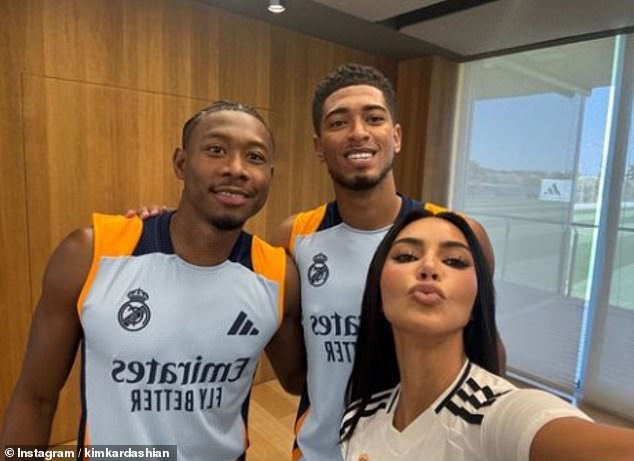 The influencer put her famous selfie skills to work and snapped this photo with players David Alaba (left) and Jude Bellingham (right).