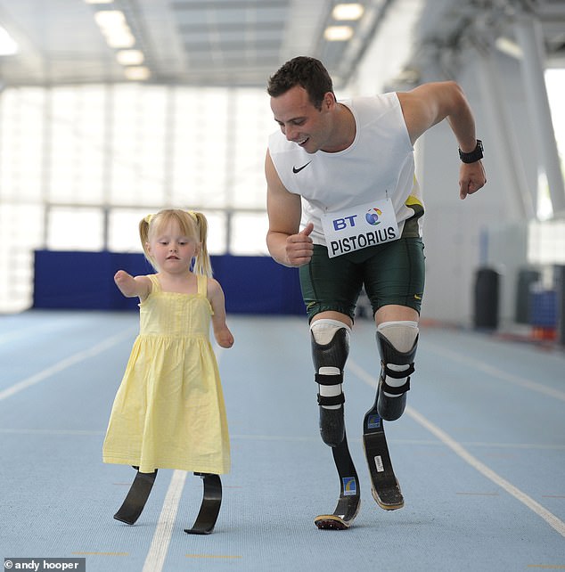 Challis was photographed alongside six-time Paralympic champion Oscar Pistorius in 2009