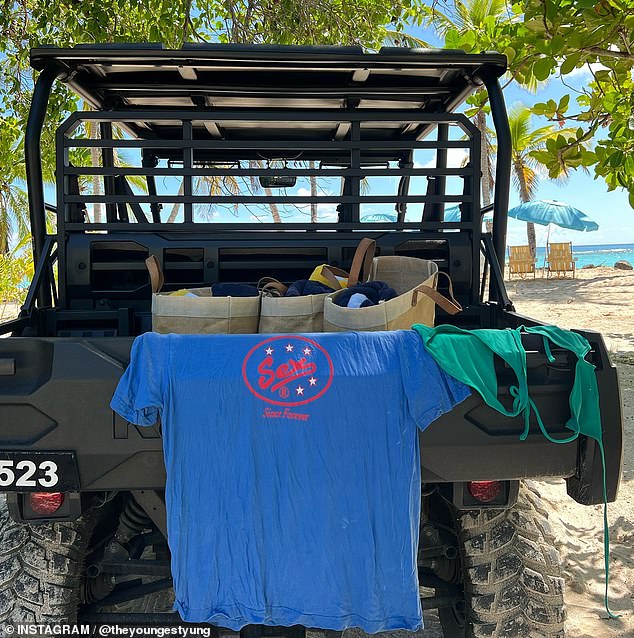 She also shared a snap of a 'Sex' T-shirt and her green bikini top draped over the back of a beach buggy.