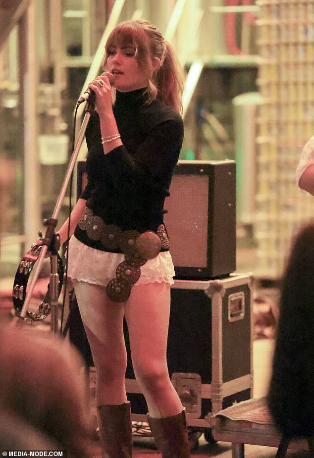 The performer completed her look with a brass concho belt as she sang and played the tambourine for the crowd gathered for the concert.