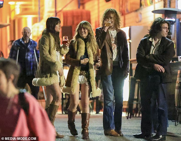 Mia donned a fur-lined coat and enjoyed drinks as she mingled with friends who had come to support her.