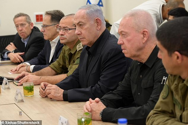 Prime Minister Benjamin Netanyahu (center) and Israeli Defense Minister Yoav Gallant (second from right) are pictured at a military base in Tel Aviv, Israel, August 25, 2024.