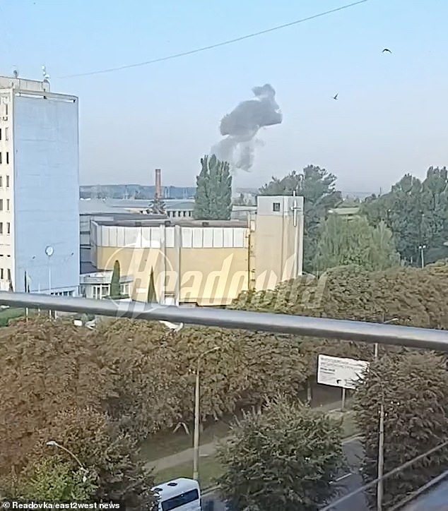 Smoke rises above a building in western Ukraine amid one of Russia's airstrikes on the country since the war began