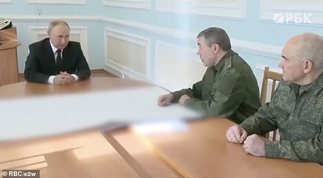 A visibly enraged Putin is seen in a muted video of a weekend meeting with top military chiefs.