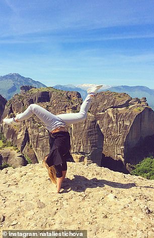 Here he is doing a gymnastics move near what appears to be the edge of a mountain.