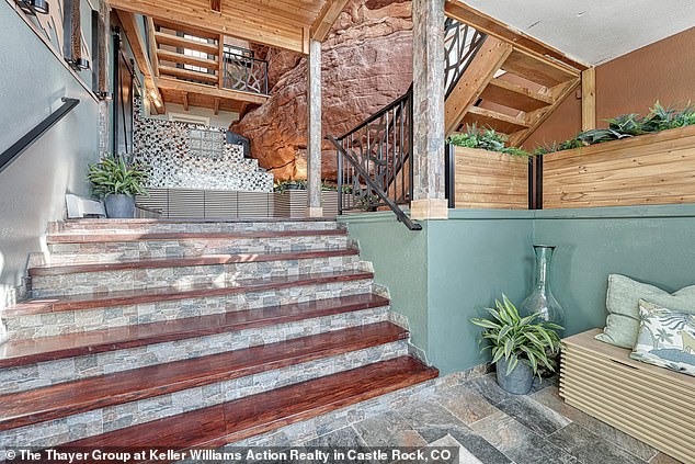 'Head upstairs to the landing where you'll find an entrance to the home's featured outdoor terrace and viewing space,' the listing states.